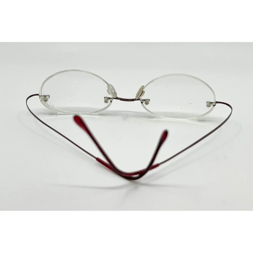 Dollar Optical Eyeglasses Unisex Red Beta Titanium Rimless Oval BT 2000 150